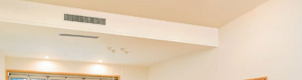 Archived interior showing a discreet ducted air-conditioning installation